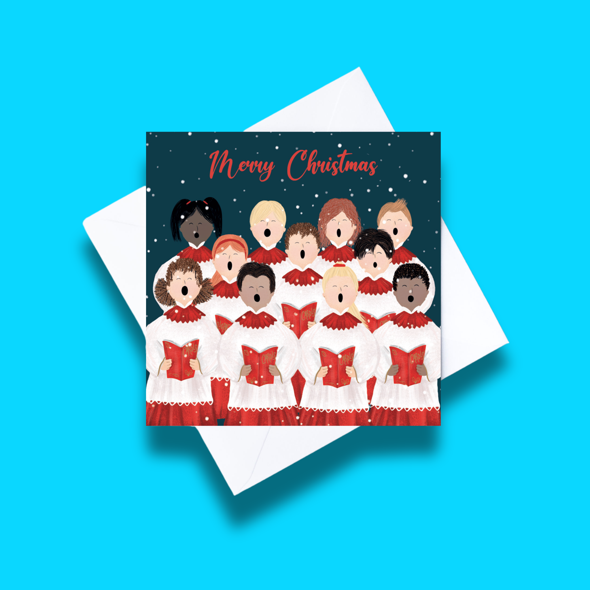 Christmas Choir Christmas card with white envelope on a blue background. Card design features 11 people singing on a starry dark background and merry Christmas text