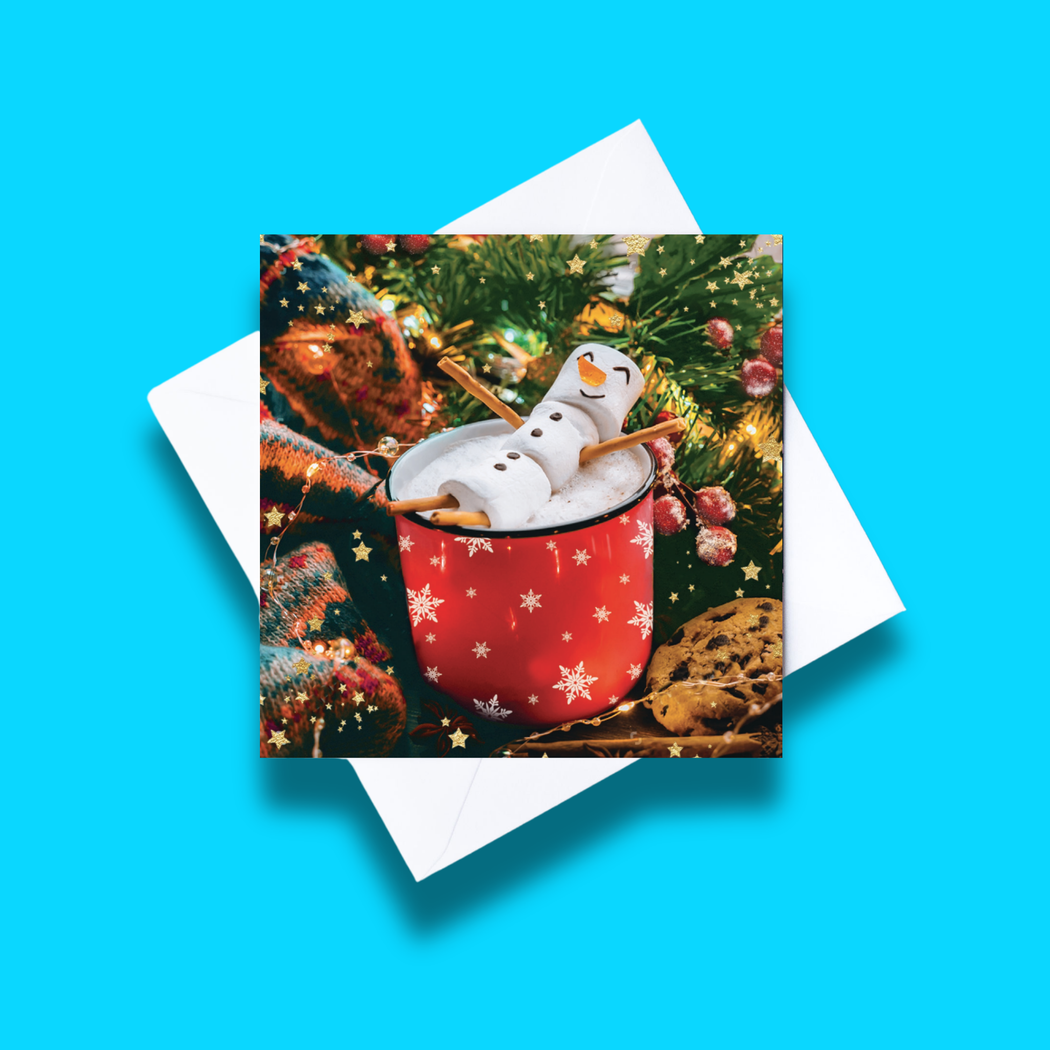 Relax, it's Christmas! Christmas card with white envelope on a blue background. Card design features a marshmallow snowman lying in a mug of hot chocolate on a festive background in a photographic style