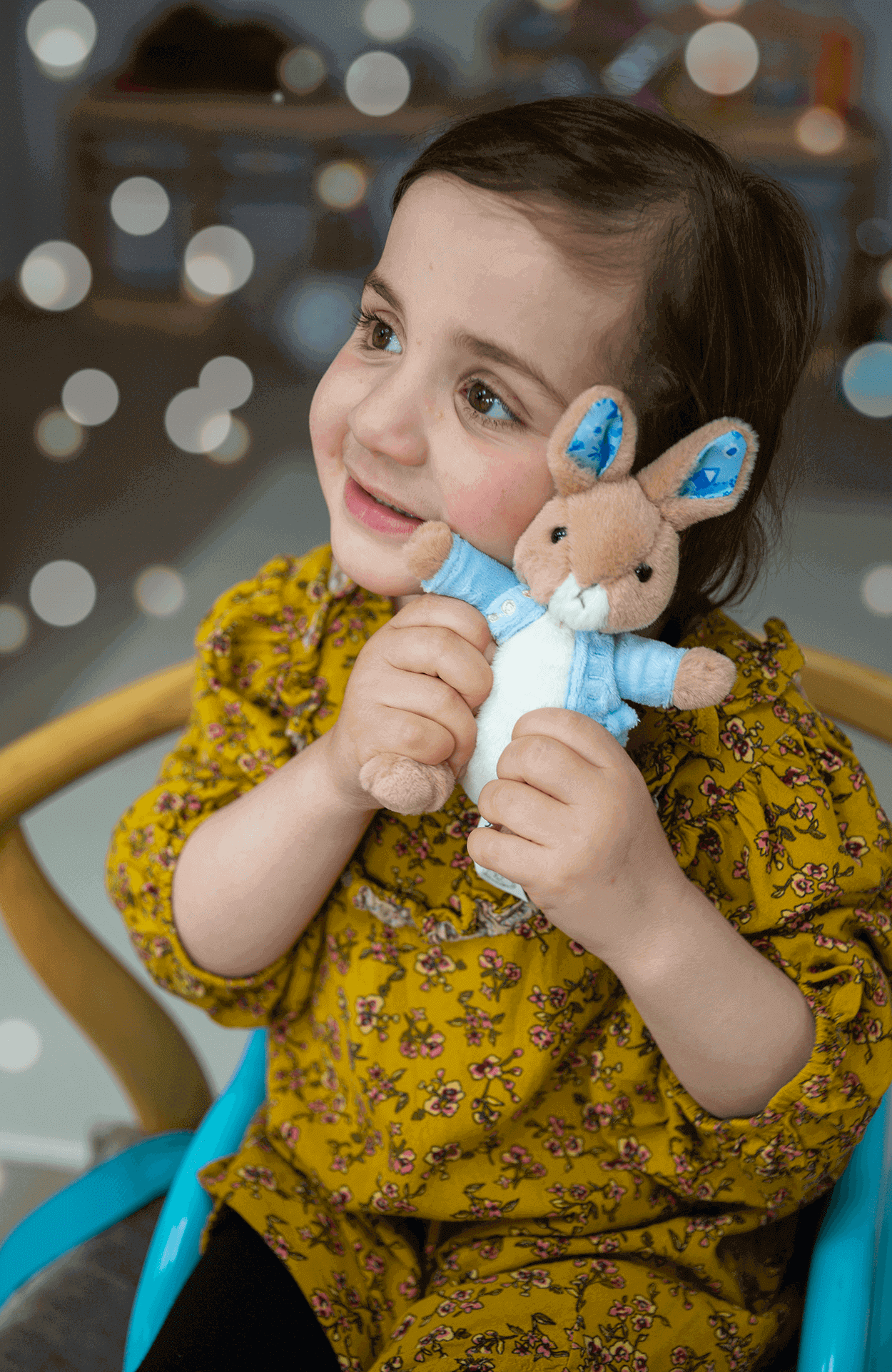 Emmie_holding_a_gosh_peter_rabbit_soft_toy